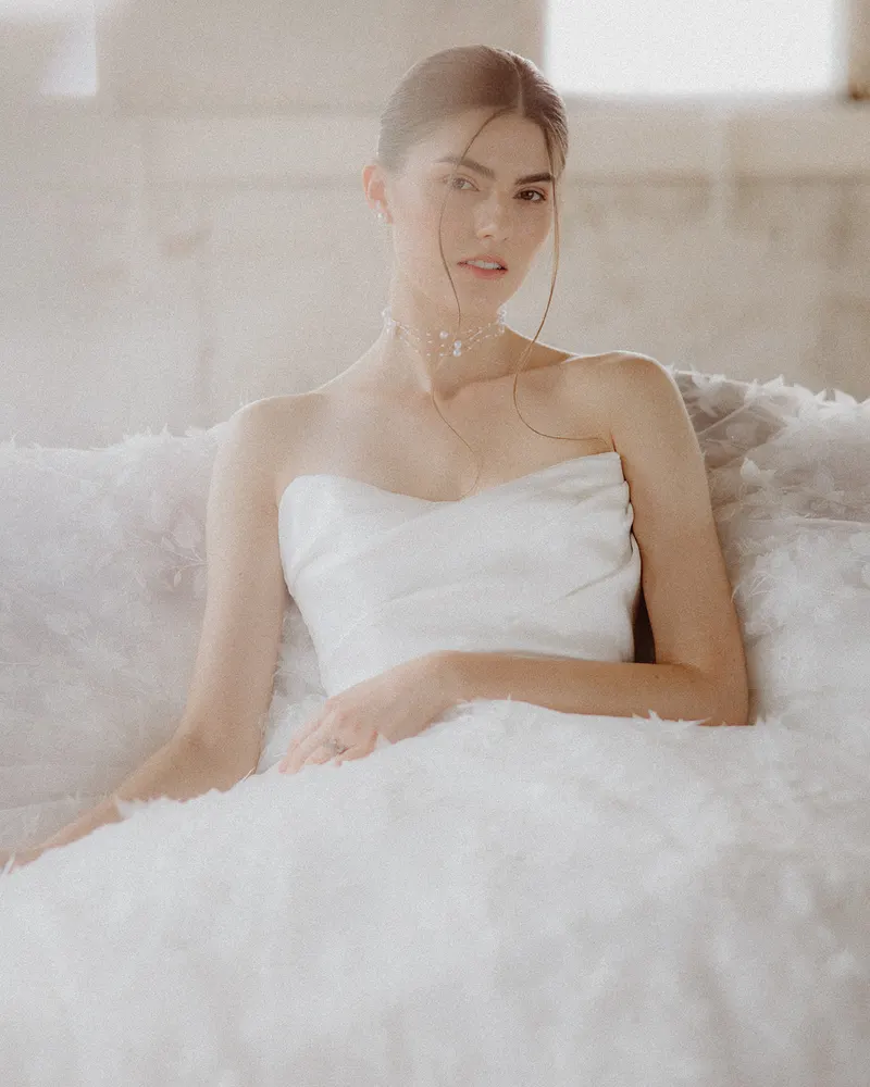 Bride smiling in a strapless gown